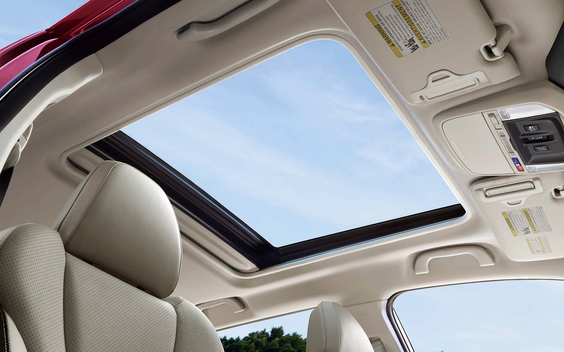 A view through the power sliding panoramic moonroof on the 2022 Forester Sport. | Subaru of Spartanburg in Spartanburg SC