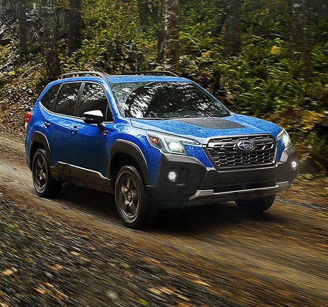 A 2022 Forester driving on a highway. | Subaru of Spartanburg in Spartanburg SC