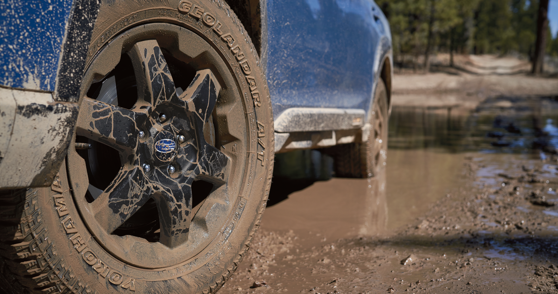 A close-up of the 17-inch off-road wheels and all-terrain Yokohama GEOLANDAR® tires on the 2023 Outback Wilderness. | Subaru of Spartanburg in Spartanburg SC