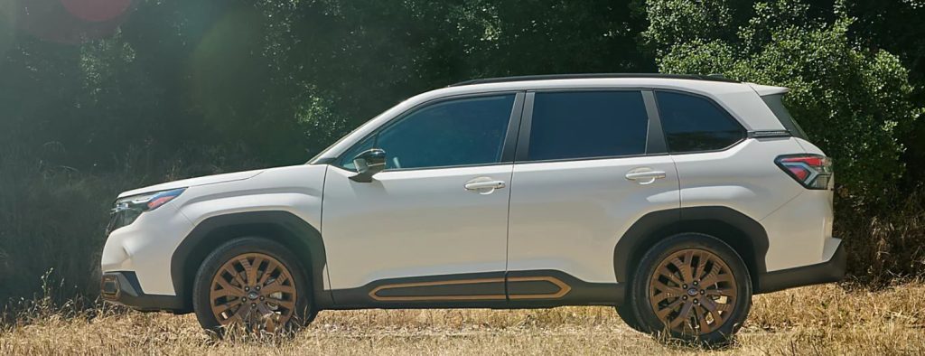 A white new Subaru Forester sits parked from the side, showcasing it's incredible style and design. Shop for your new Subaru Forester at Subaru of Spartanburg today!