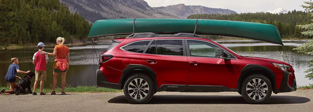 The new Subaru Outback is parked next to a lake with a canoe tied to its roof and a family standing off to the side, making this crossover SUV a perfect family car. Shop for your new Subaru Outback at Subaru of Spartanburg today!